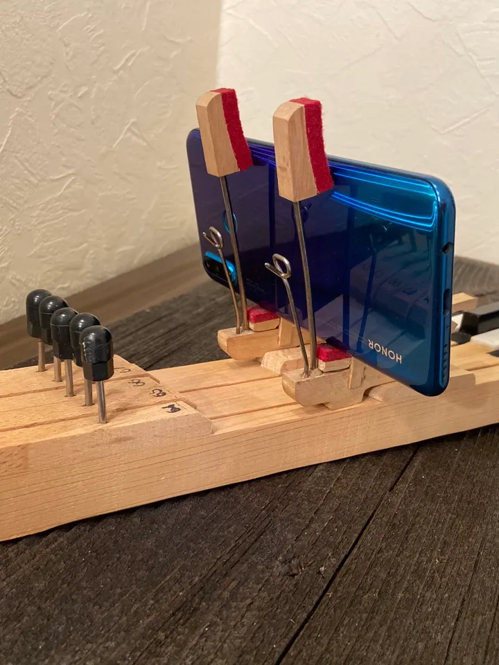 Phone stand made from old piano keys