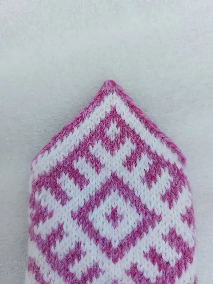Women's hand-knitted wool mittens are very warm with a pattern