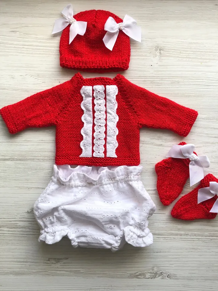 Knit red sweater with white lace, white lace panties, hat with bows and pearls, socks. Take home outfit for baby. Baby shower gift for girl