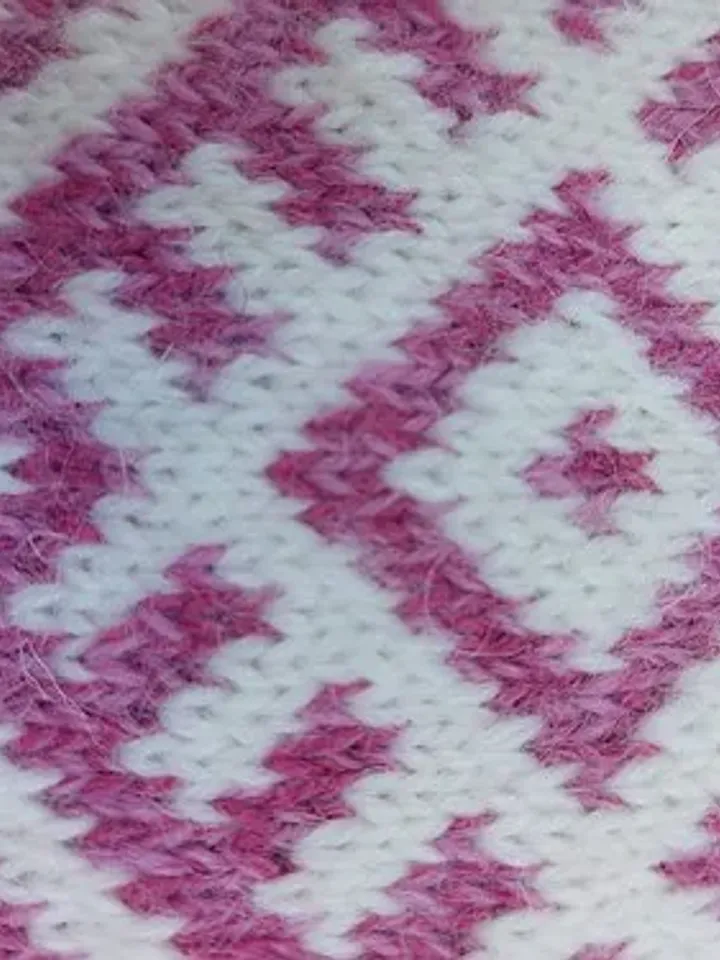 Women's hand-knitted wool mittens are very warm with a pattern