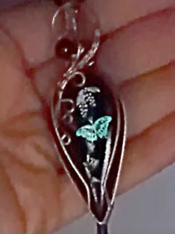 Black Necklace with a luminous butterfly. Luminous pendant as a gift. Jewelry of black stone on the neck