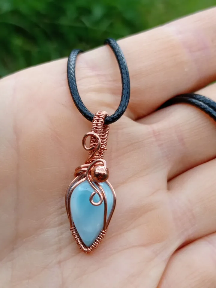 A tiny copper necklace with a rare precious larimar.