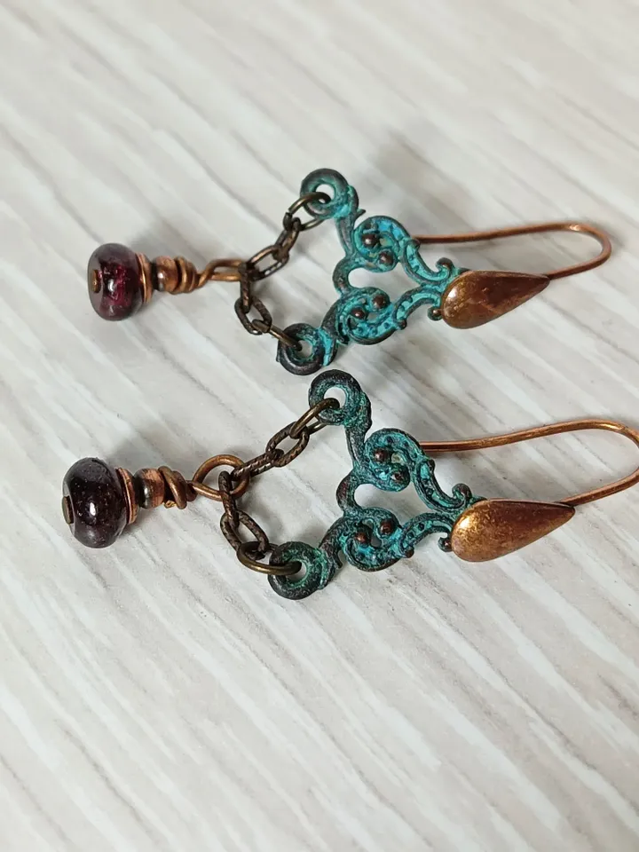 Boho Shabby chic Vintage style solid and natural copper earrings Textured patinated with a garnet bead and chain