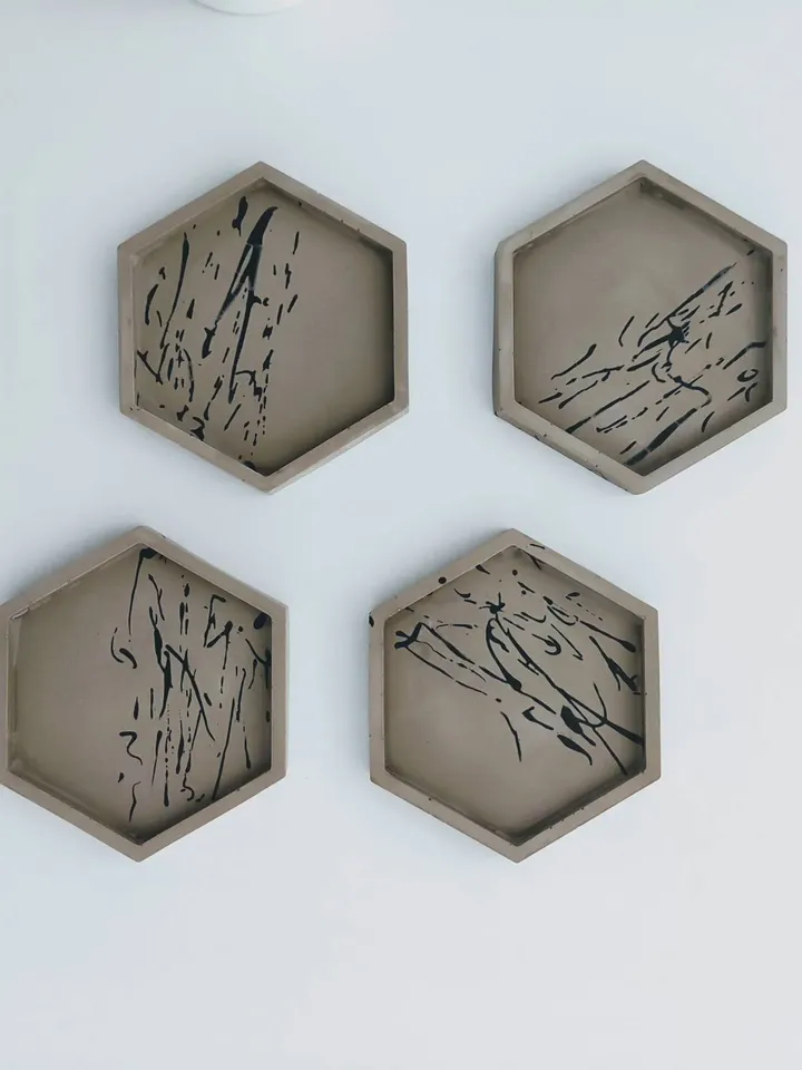 Jesmonite hexagonal trays / coasters with splashes in greige