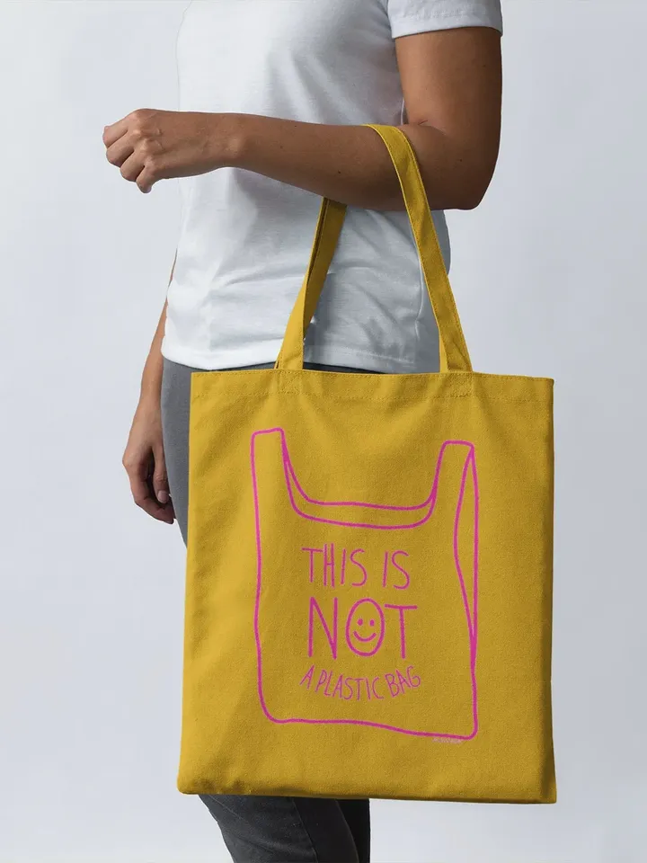 NOT A PLASTIC tote Mustard is a eco vegan friendly reusable grocery bag, market bag, gym bag. Say No to Plastic with this anti plastic tote.
