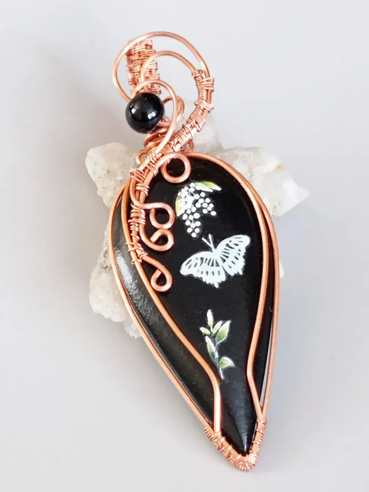 Black Necklace with a luminous butterfly. Luminous pendant as a gift. Jewelry of black stone on the neck