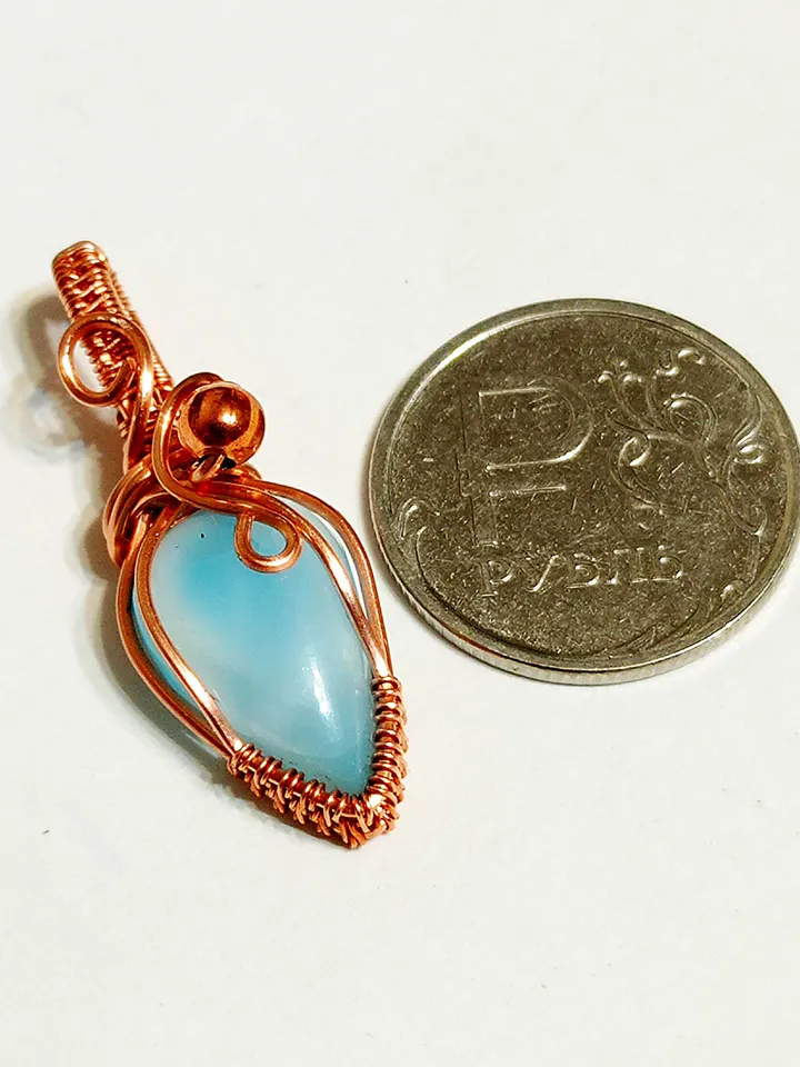 A tiny copper necklace with a rare precious larimar.