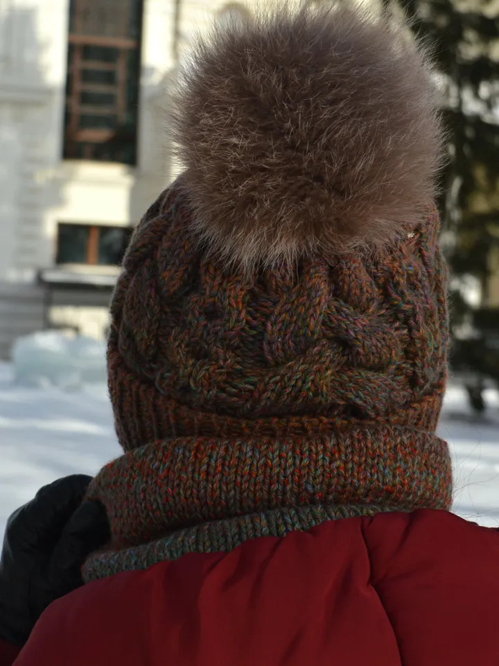 Set of knitted accessories hat with fur pompom and snood