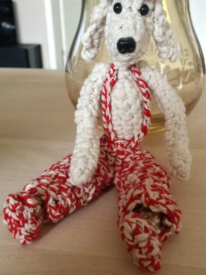 Crochet fantasy doggy of cotton, plastic eyelets and cream, mixed