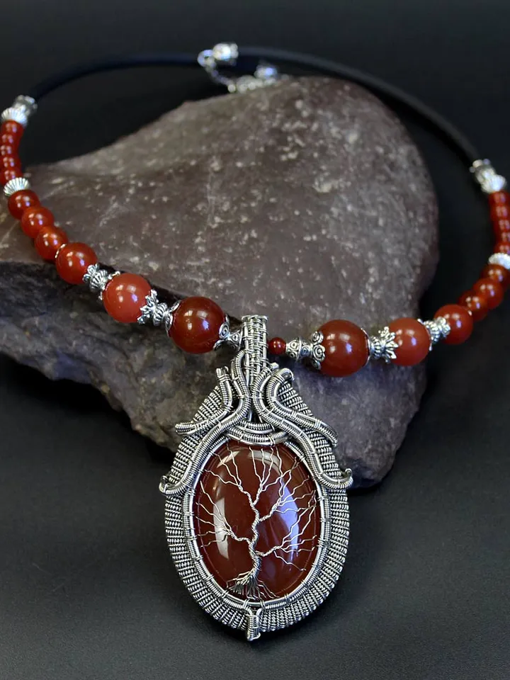 The Tree of Life necklace is handmade with natural birthstones.