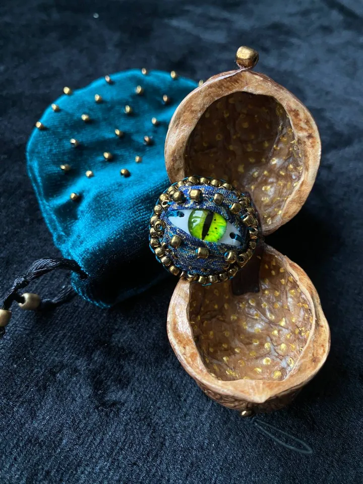 Green dragon eye brooch in walnut shell, green eye badge