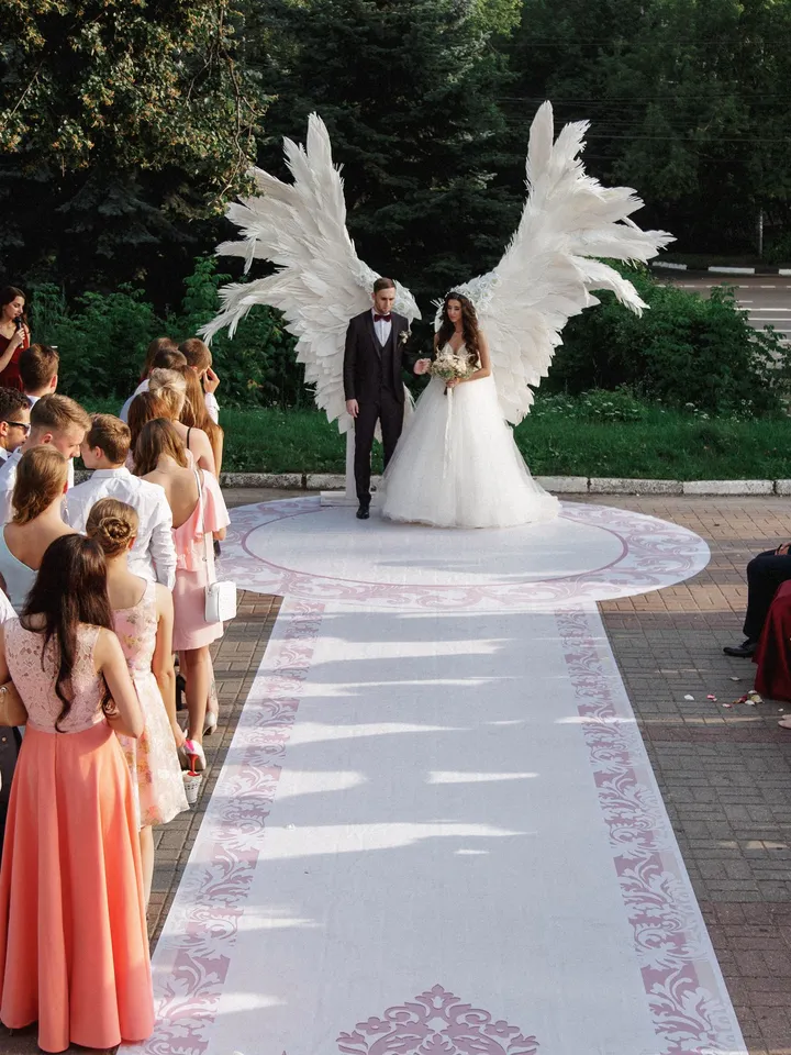 Giant angel wings wedding backdrop on metal stand, luxury street party decoration