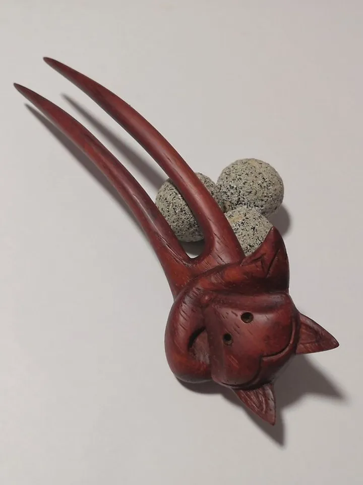 Carved wooden hairpin with a fox.