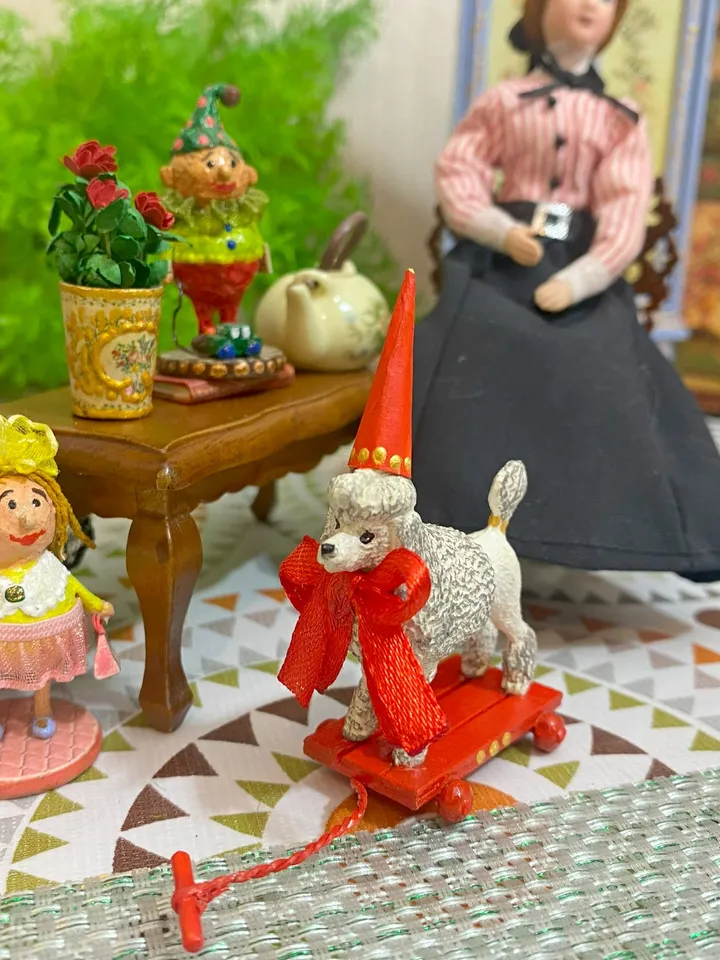 Poodle on a cart. Doll toy. Scale 1:12.