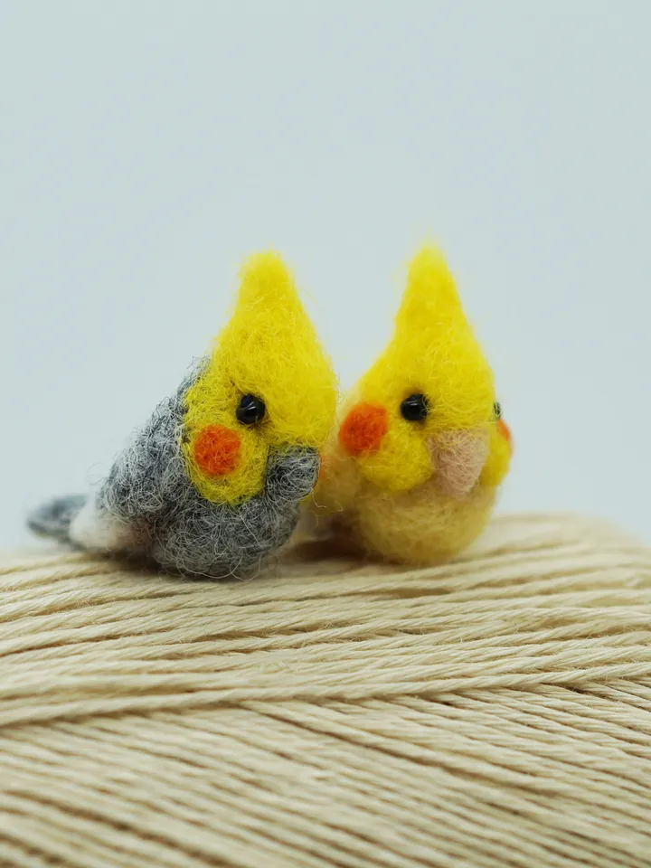 A pair of tiny needle felted miniature cockatiels, made to order