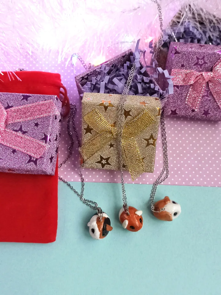a Cute Guinea pig ball necklace in random color  (US discount)