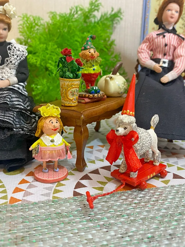 Poodle on a cart. Doll toy. Scale 1:12.