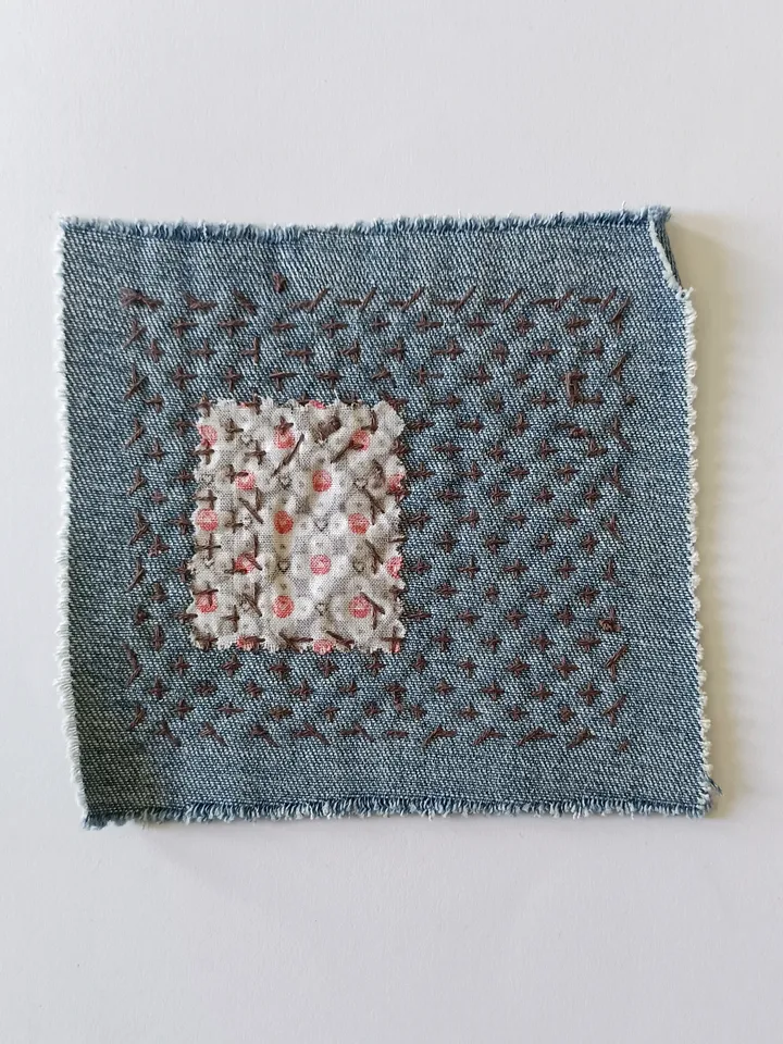 Upcycled denim boro patch. Sashiko stitching.