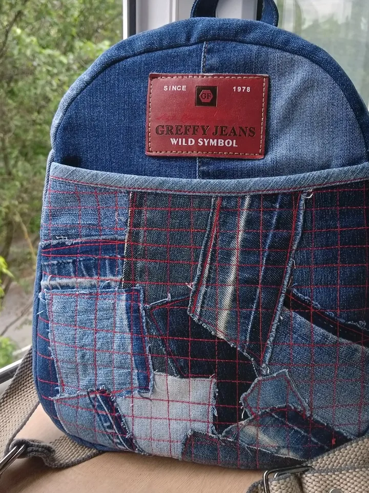 Stylish HANDMADE denim BACKPACK WITH a DEEP POCKET IN THE FRONT IN the lazy boro Patchwork STYLE and lined with red plai