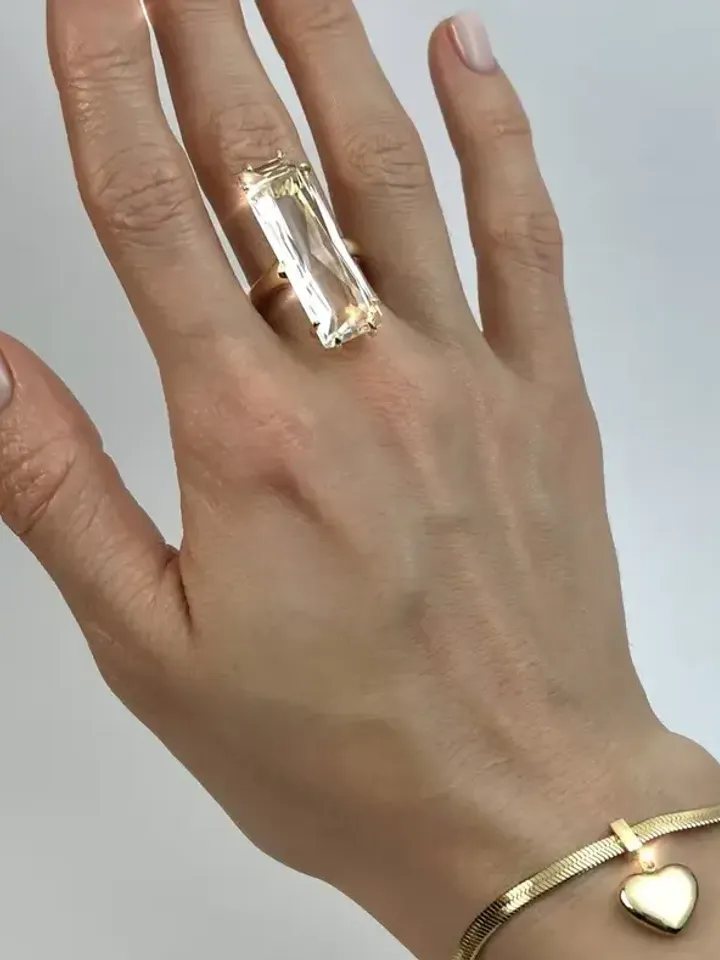 Ring gilded with a large rectangular crystal stone, one-size adjustable 16-20 size