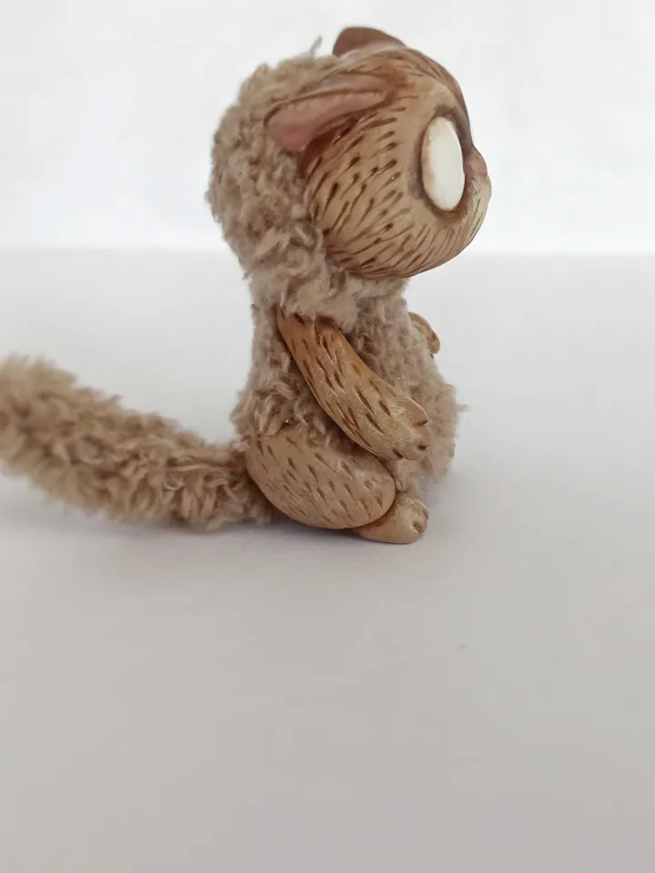 Discouraged cat doll