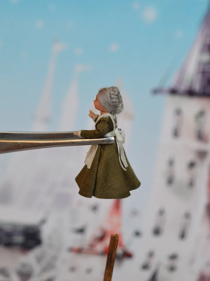 Miniature doll in the 48th scale. Grandmother for a dollhouse.