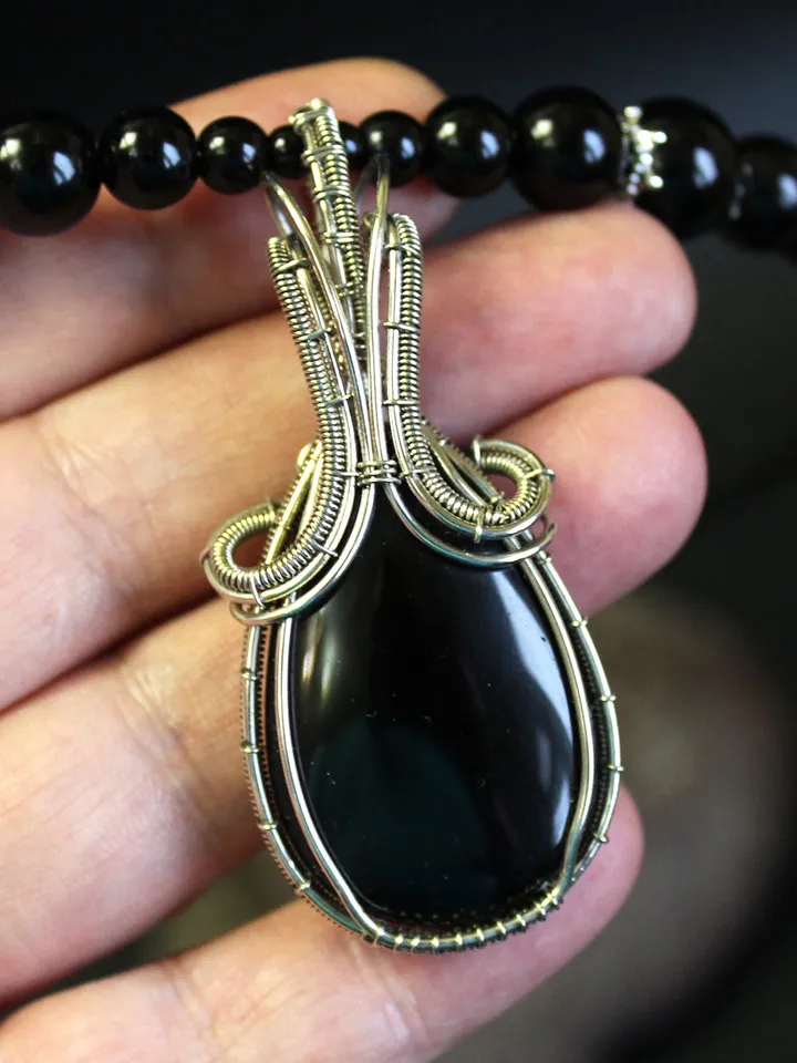 Handmade necklace made of natural stones. Wire wrapped stone pendant.