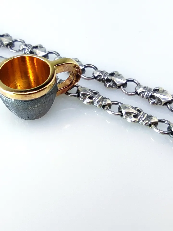 Set of miniature cup and gaitan (cord)