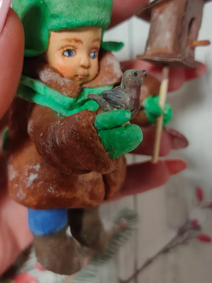 A boy with a birdhouse.