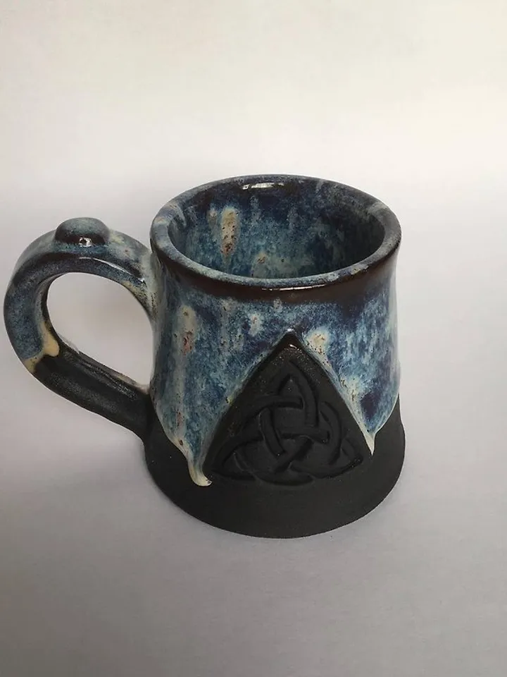 Trinity knot Triquetra in circle blue and black galaxy glazed stoneware mug
