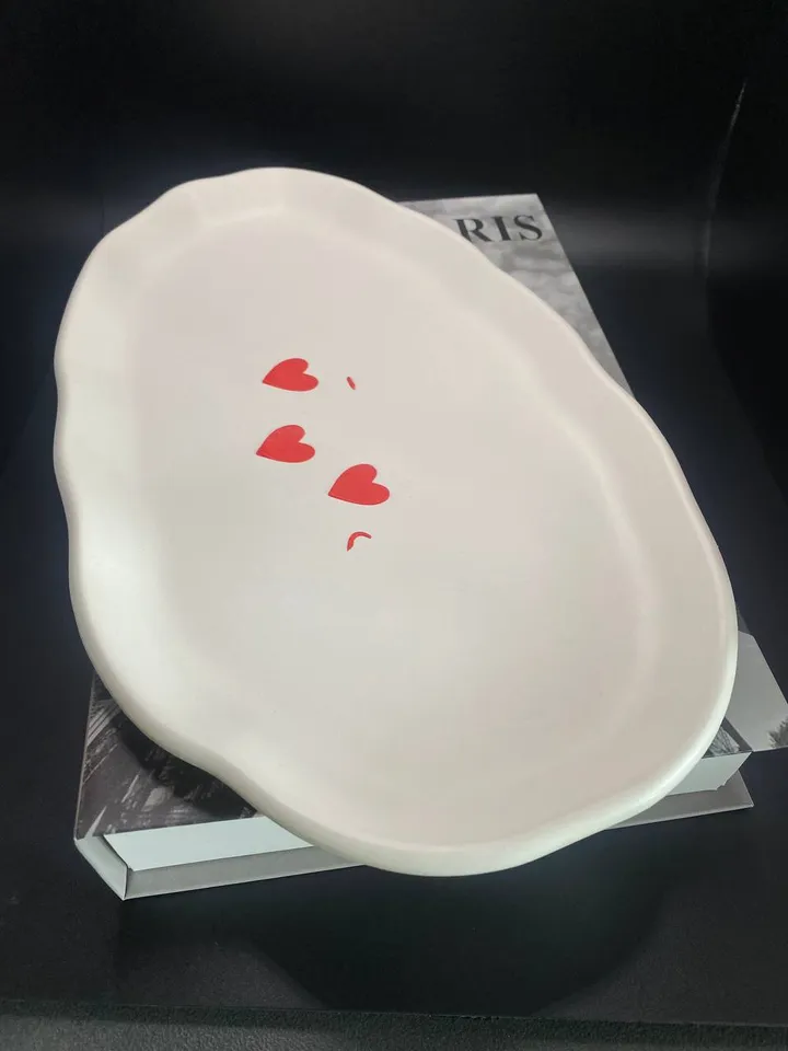 White oval tray with heart pattern