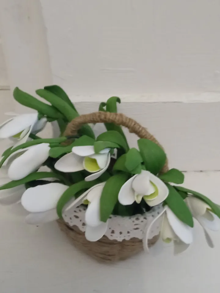 A bouquet of delicate handmade snowdrops in a basket. Mother's day gifts Gifts for her