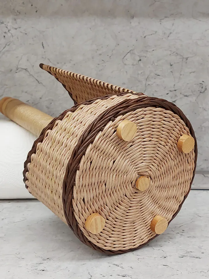 Rustic paper towel holder with wooden tip. Storage and decor on the countertop