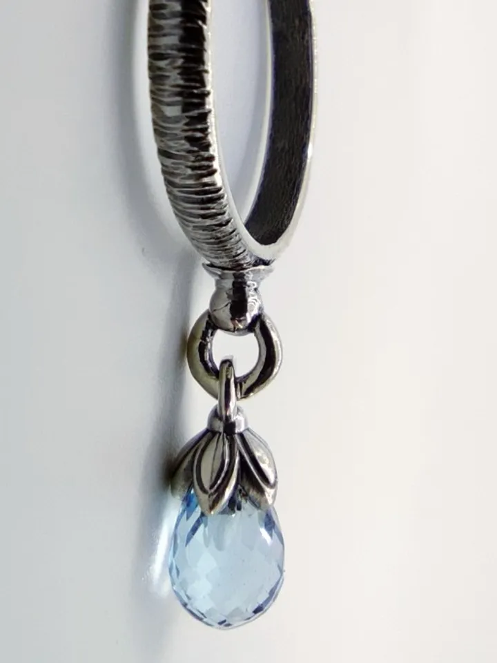 Ring with blue topaz