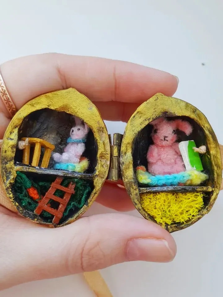 Tiny crochet miniature rabbits in a nut house