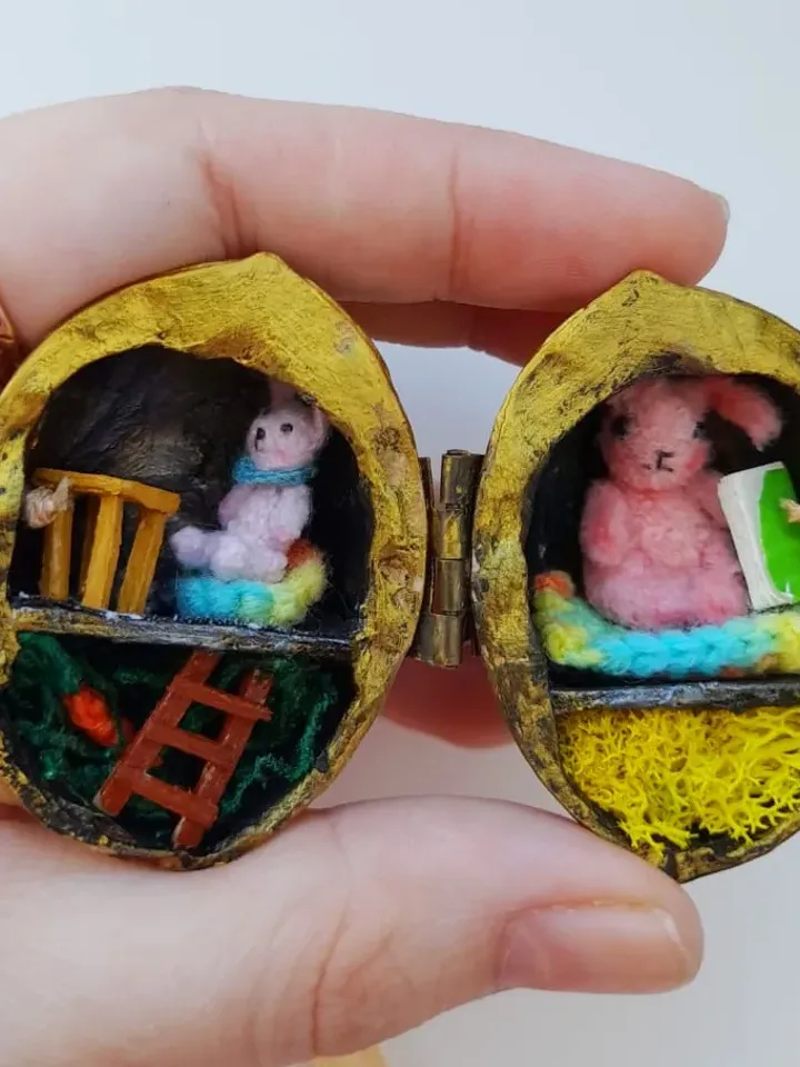 Tiny crochet miniature rabbits in a nut house