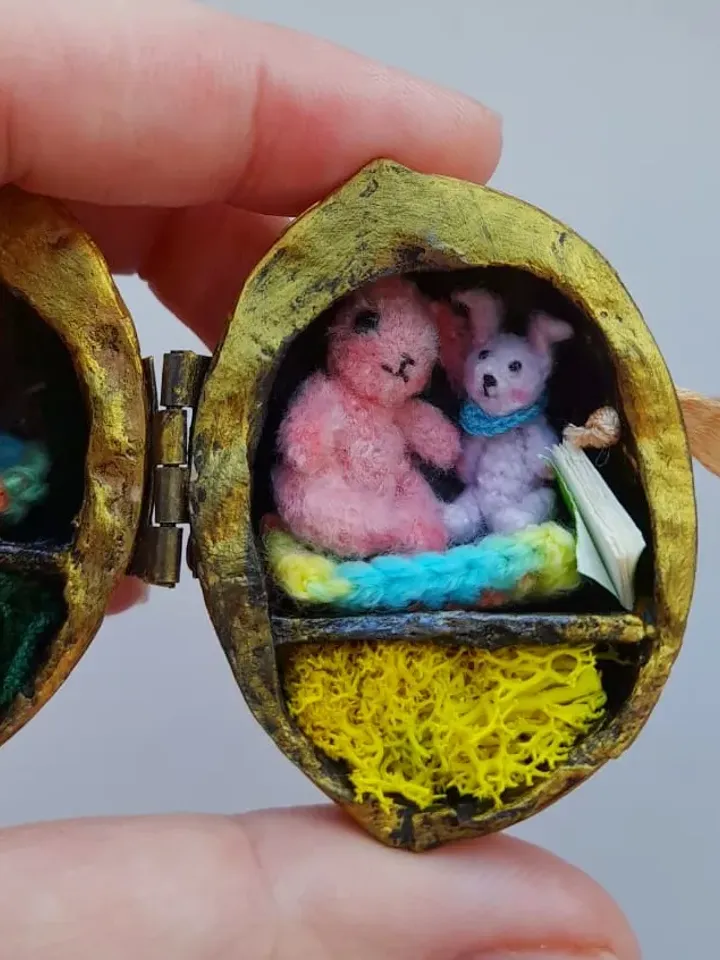 Tiny crochet miniature rabbits in a nut house