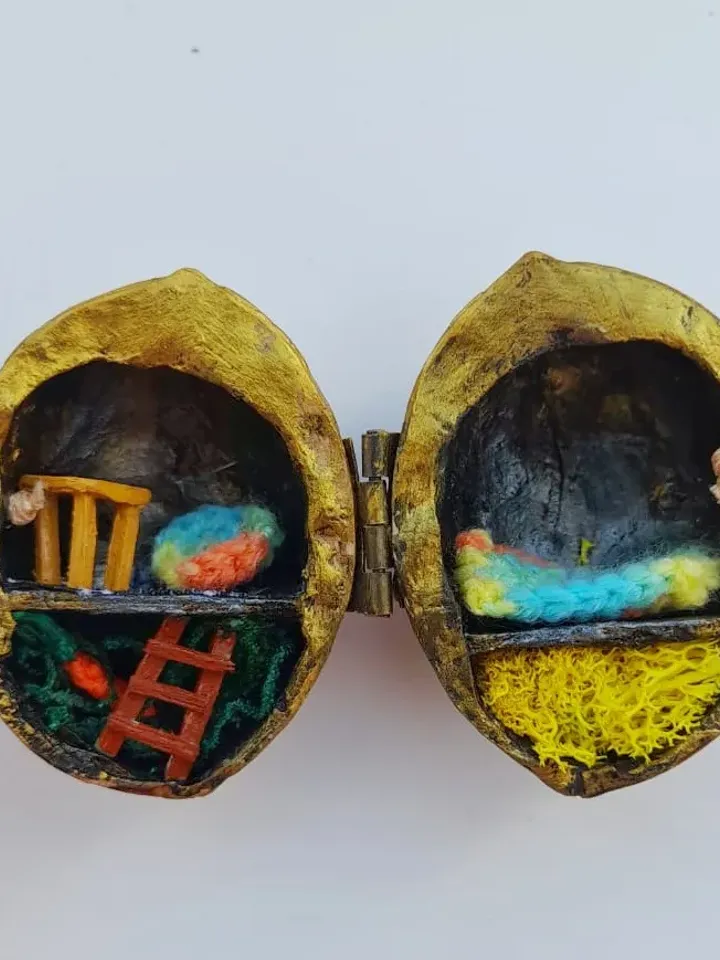Tiny crochet miniature rabbits in a nut house