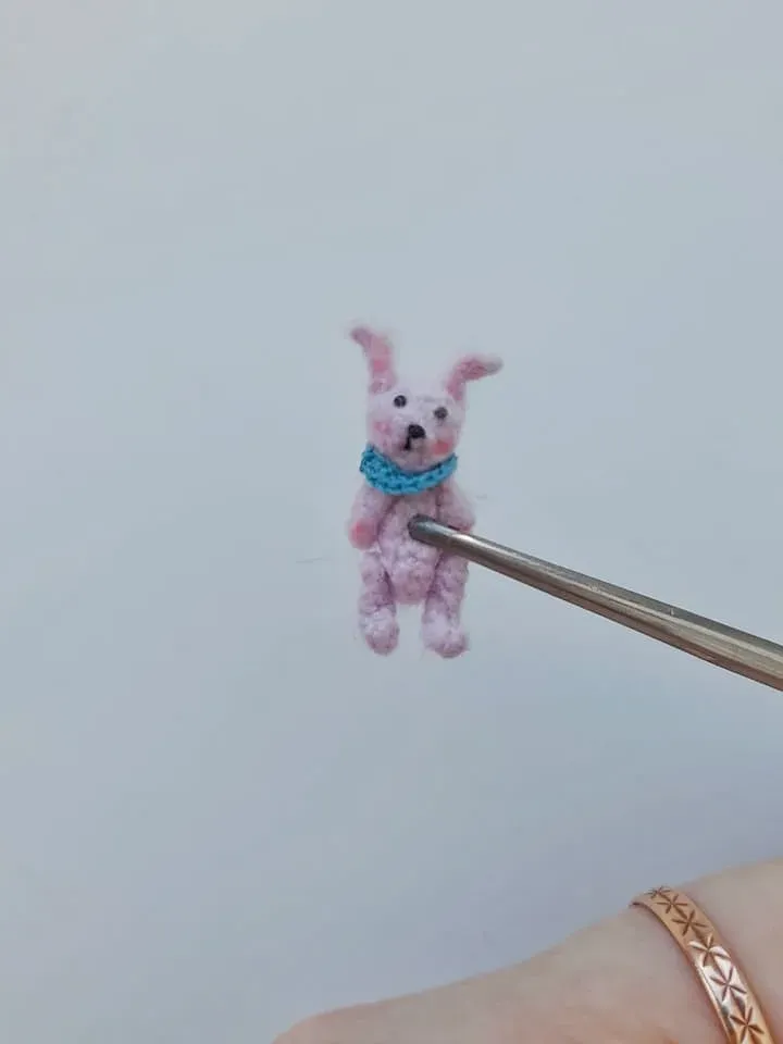 Tiny crochet miniature rabbits in a nut house