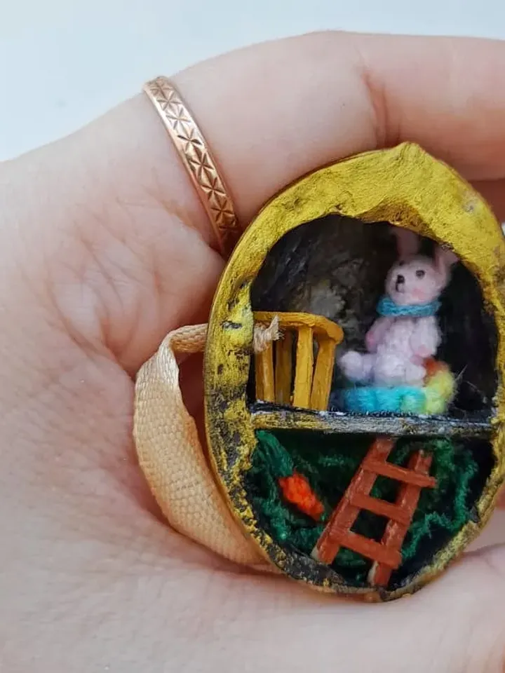Tiny crochet miniature rabbits in a nut house