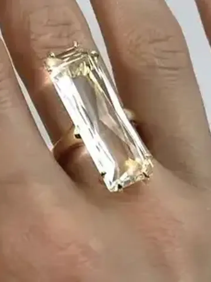 Ring gilded with a large rectangular crystal stone, one-size adjustable 16-20 size
