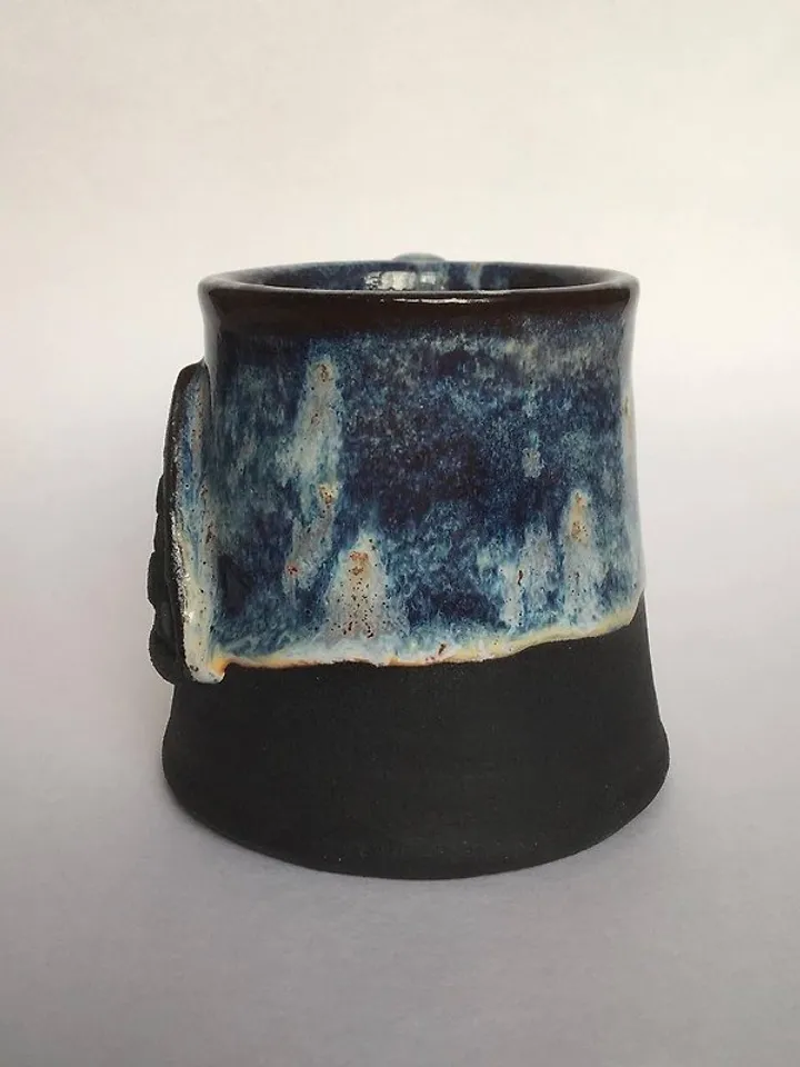 Trinity knot Triquetra in circle blue and black galaxy glazed stoneware mug