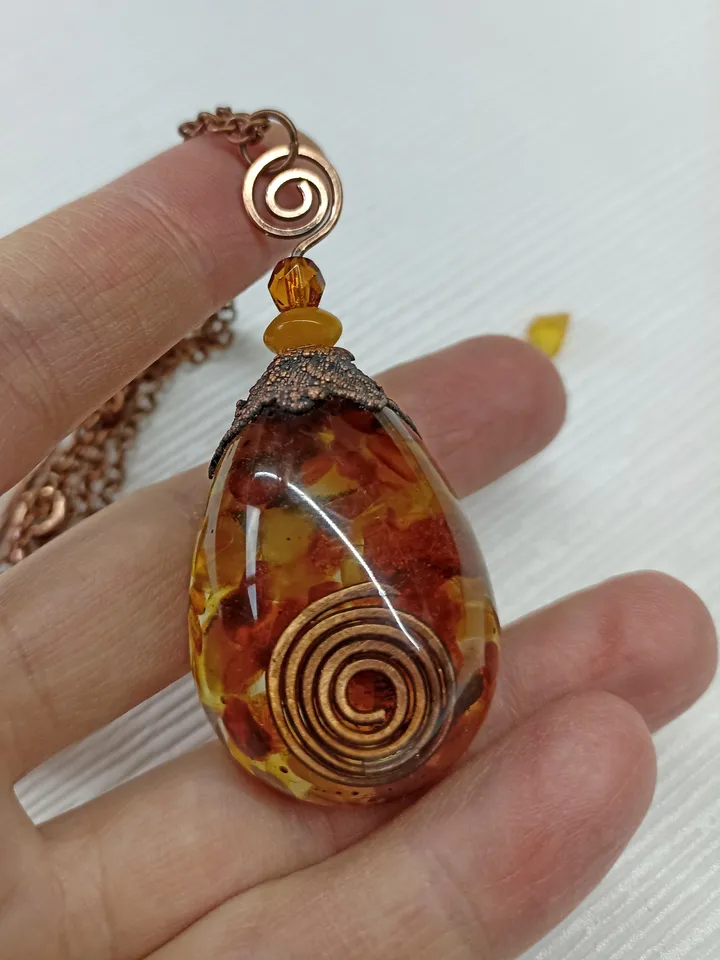 Amber Orgone pendant necklace. Raw Baltic amber chips and a copper spiral in clear eco resin powerful protection necklace generating Orgone energy