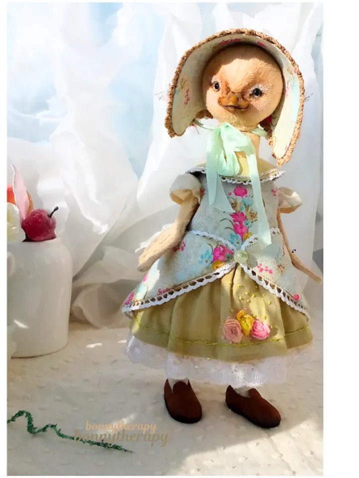 Cute duckling girl in clothes, artist doll duck