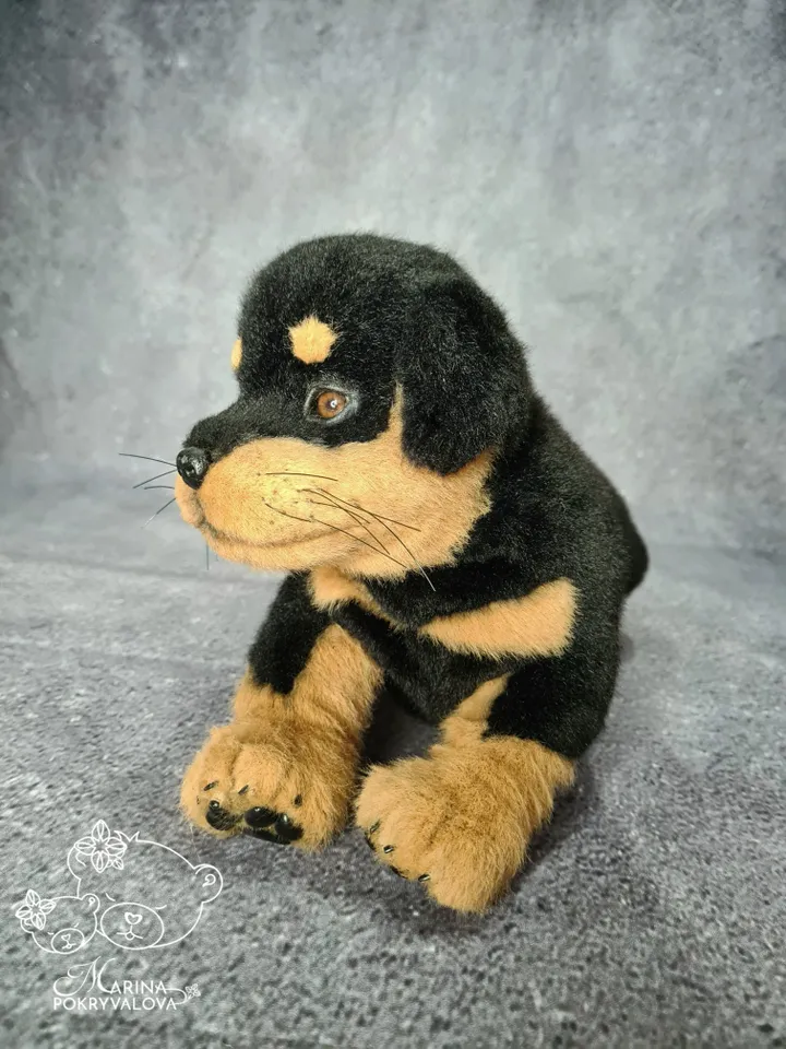 Rottweiler. Realistic dog. Lifelike toy dog. Stuffed dog.