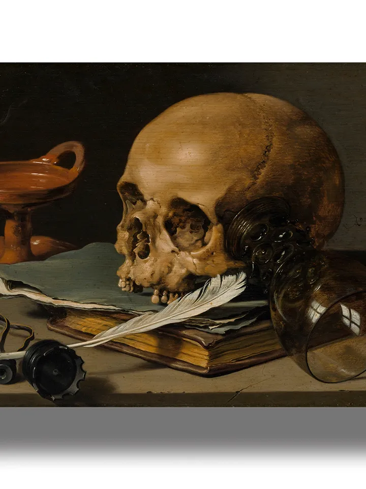 Still life with a skull and a writing quill.