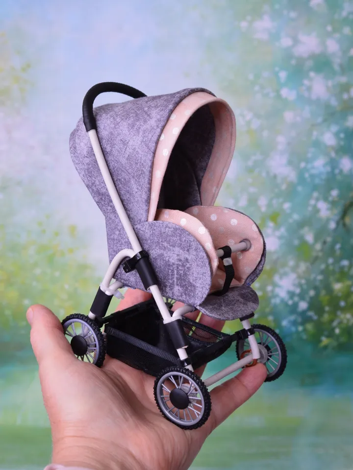 Miniature toy stroller for dolls in 1/6 scale. Accessories for small dolls and poupins. Pram for Barbie doll.