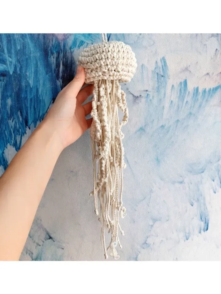 Macramé jellyfish ornament. Wall decor in the form of a jellyfish. Modern macramé. Home decor in coastal style. crocheted jellyfish