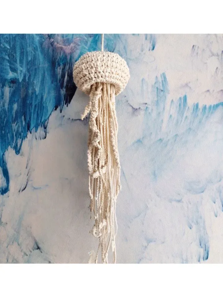Macramé jellyfish ornament. Wall decor in the form of a jellyfish. Modern macramé. Home decor in coastal style. crocheted jellyfish