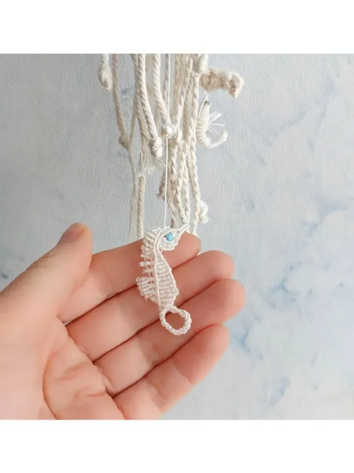 Macramé jellyfish ornament. Wall decor in the form of a jellyfish. Modern macramé. Home decor in coastal style. crocheted jellyfish